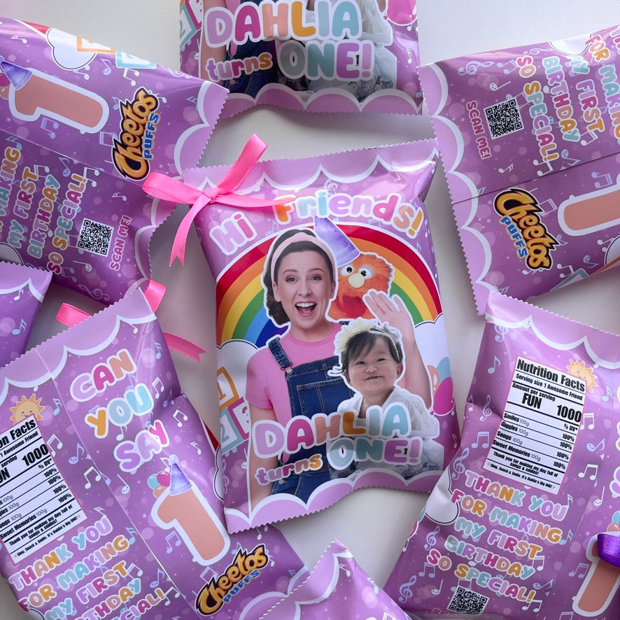 Cheetos snack packages with personalized images and text, likely for a first birthday celebration.